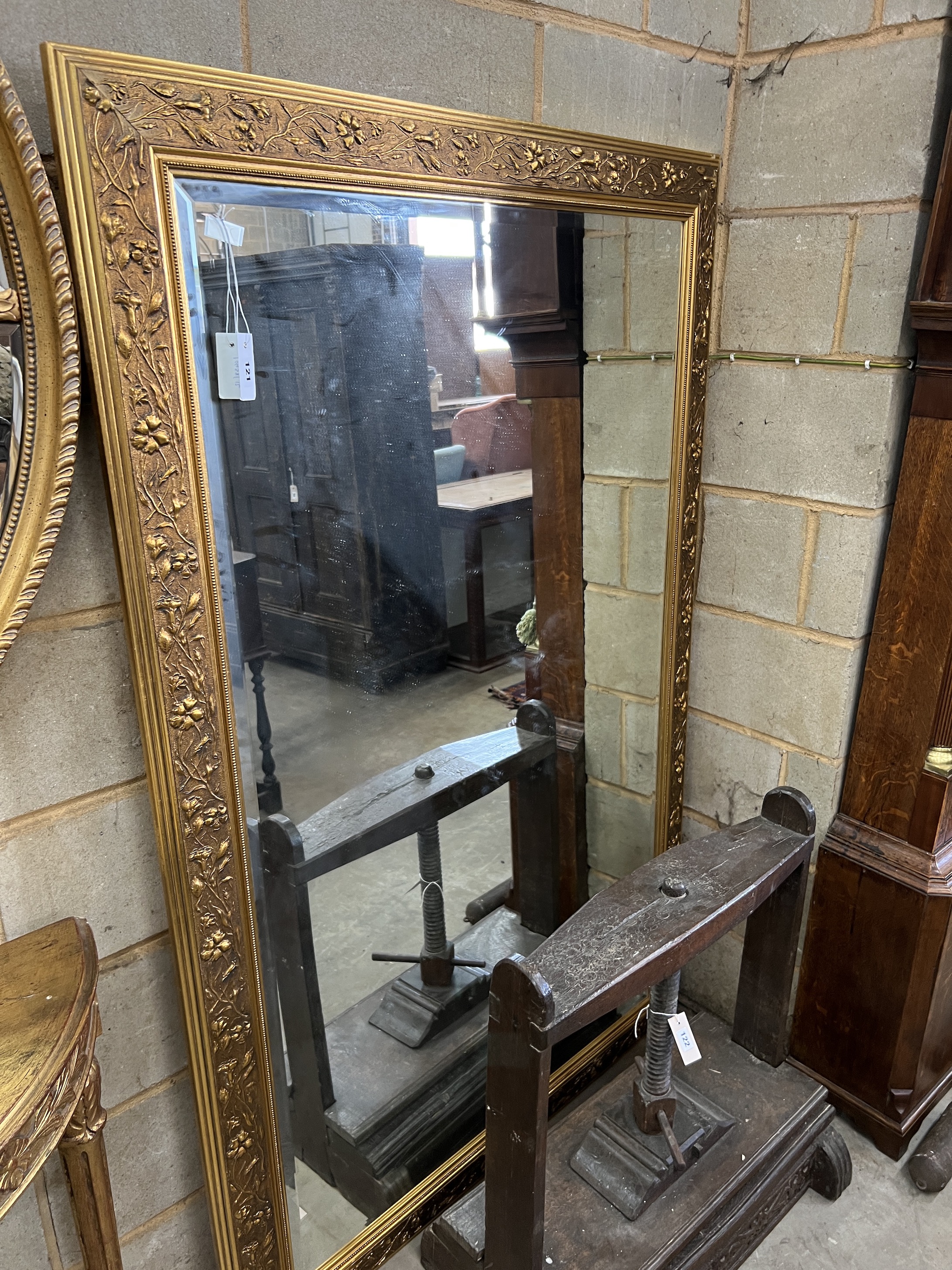 A Victorian style rectangular gilt composition wall mirror, 111cm, height 173cm